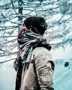 Man heating up with a scarf